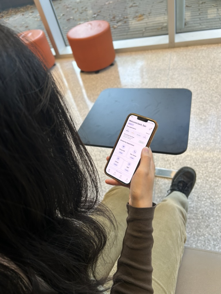 A student exploring the Drexel Works home screen on a phone during user testing